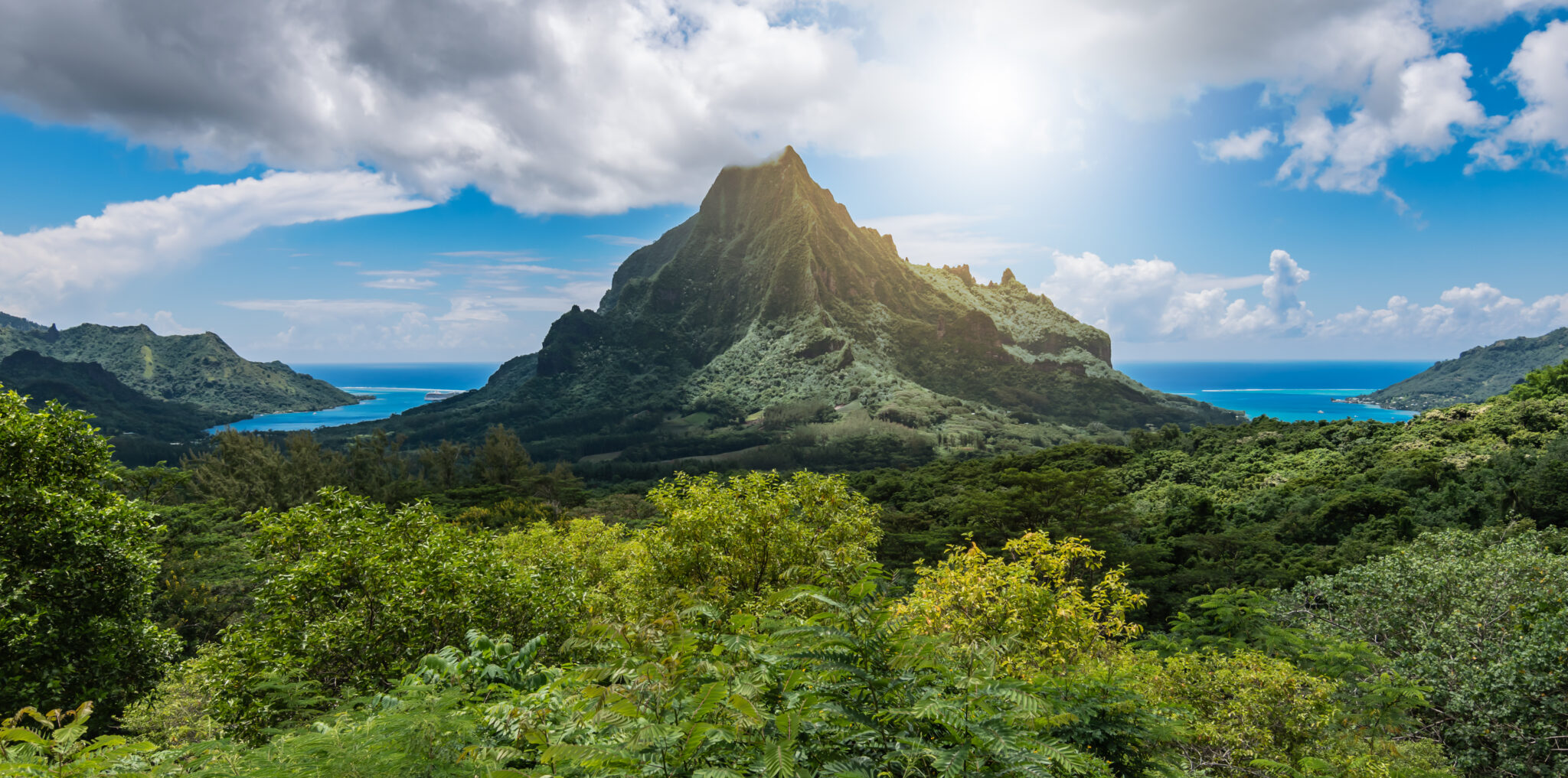 Panoramic,Mountain,Peak,Landscape,With,Cook's,Bay,And,Opunohu,Bay