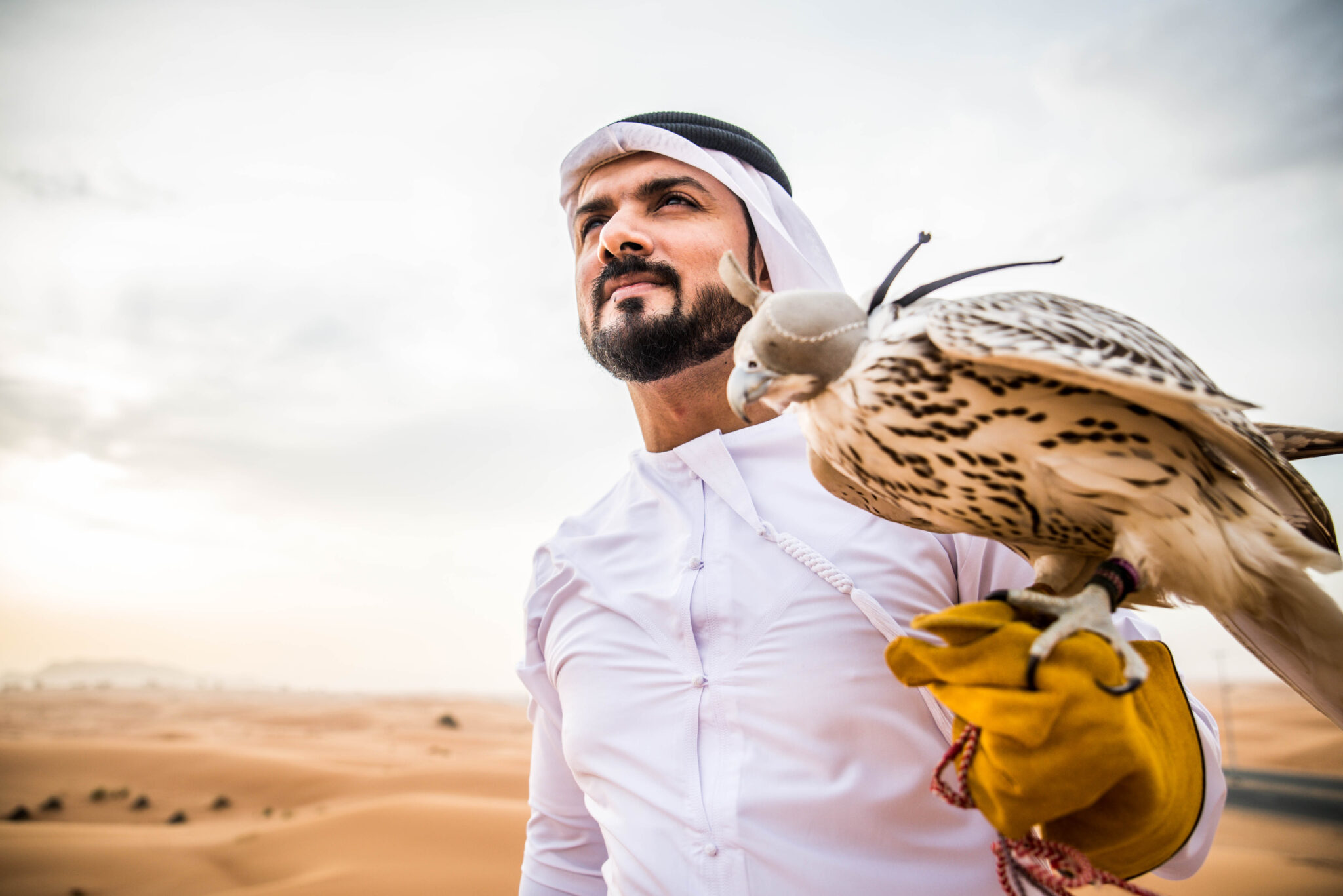 arabian-man-walking-desert-sunrise