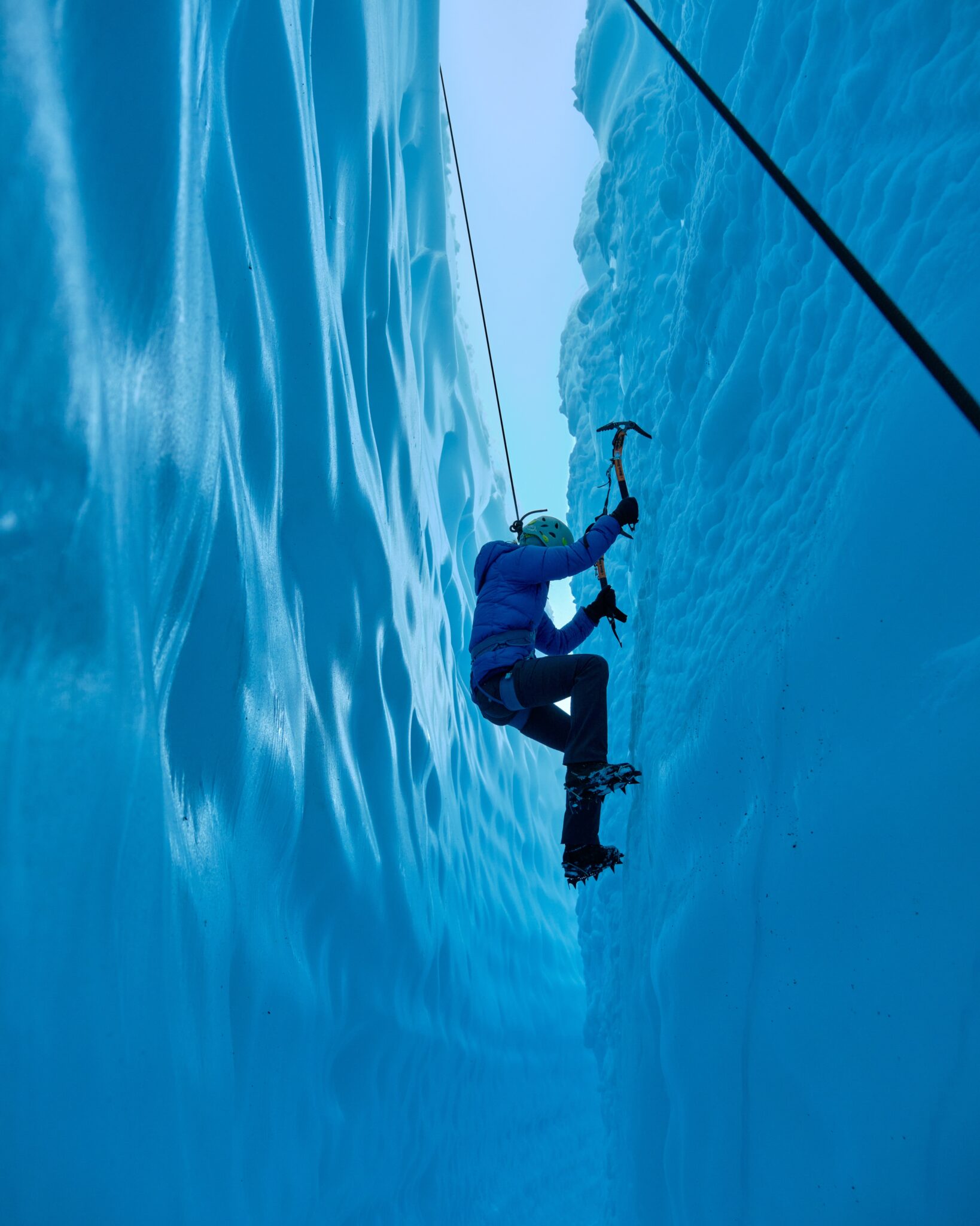 Adventurous Girl Ice Climbing Slot Canyon
