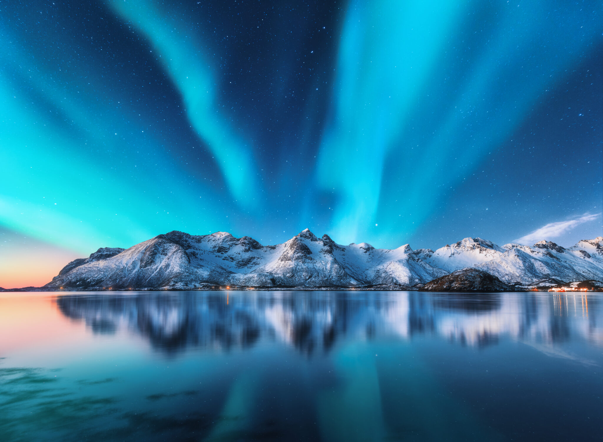 Northern,Lights,And,Snow,Covered,Mountains,In,Lofoten,Islands,,Norway.