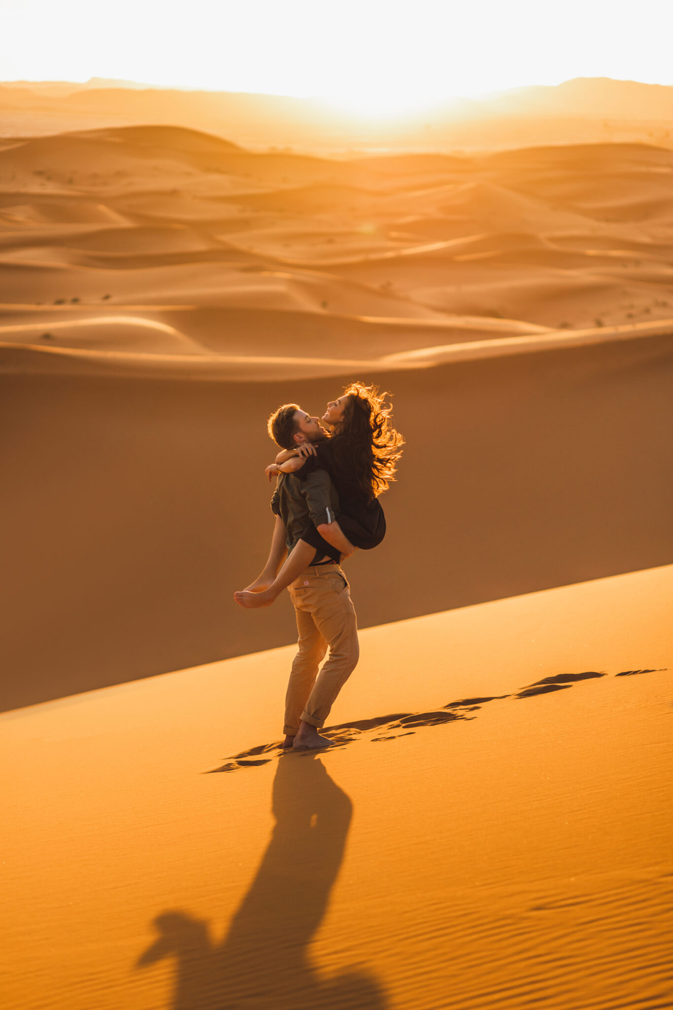 Young,Happy,Couple,In,Sahara,Desert,Dunes,,Morocco.,Happiness,,Freedom