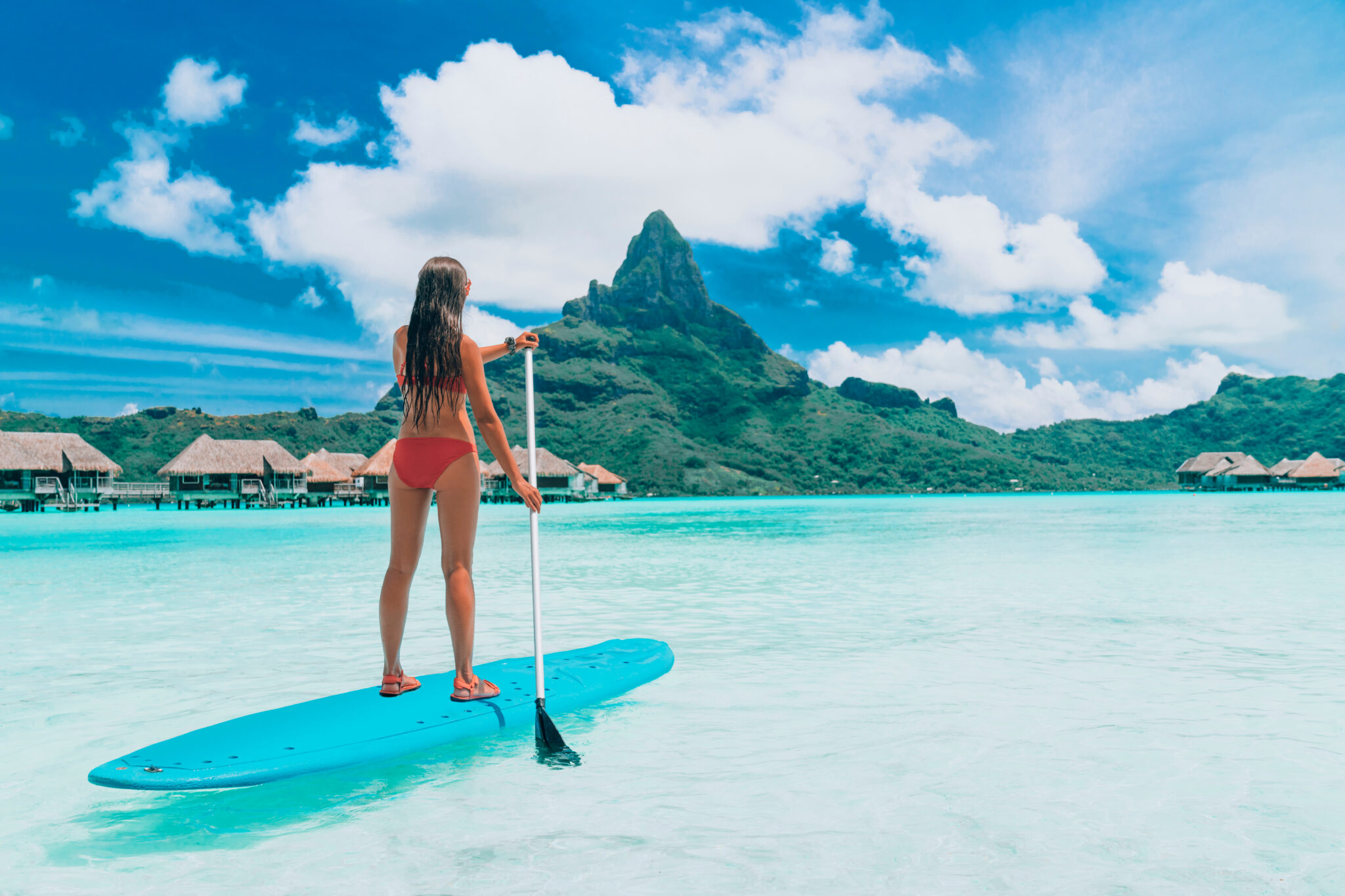 Sup,Tahiti,Paddleboard,Woman,Standing,On,Stand-up,Board,Paddling,Over