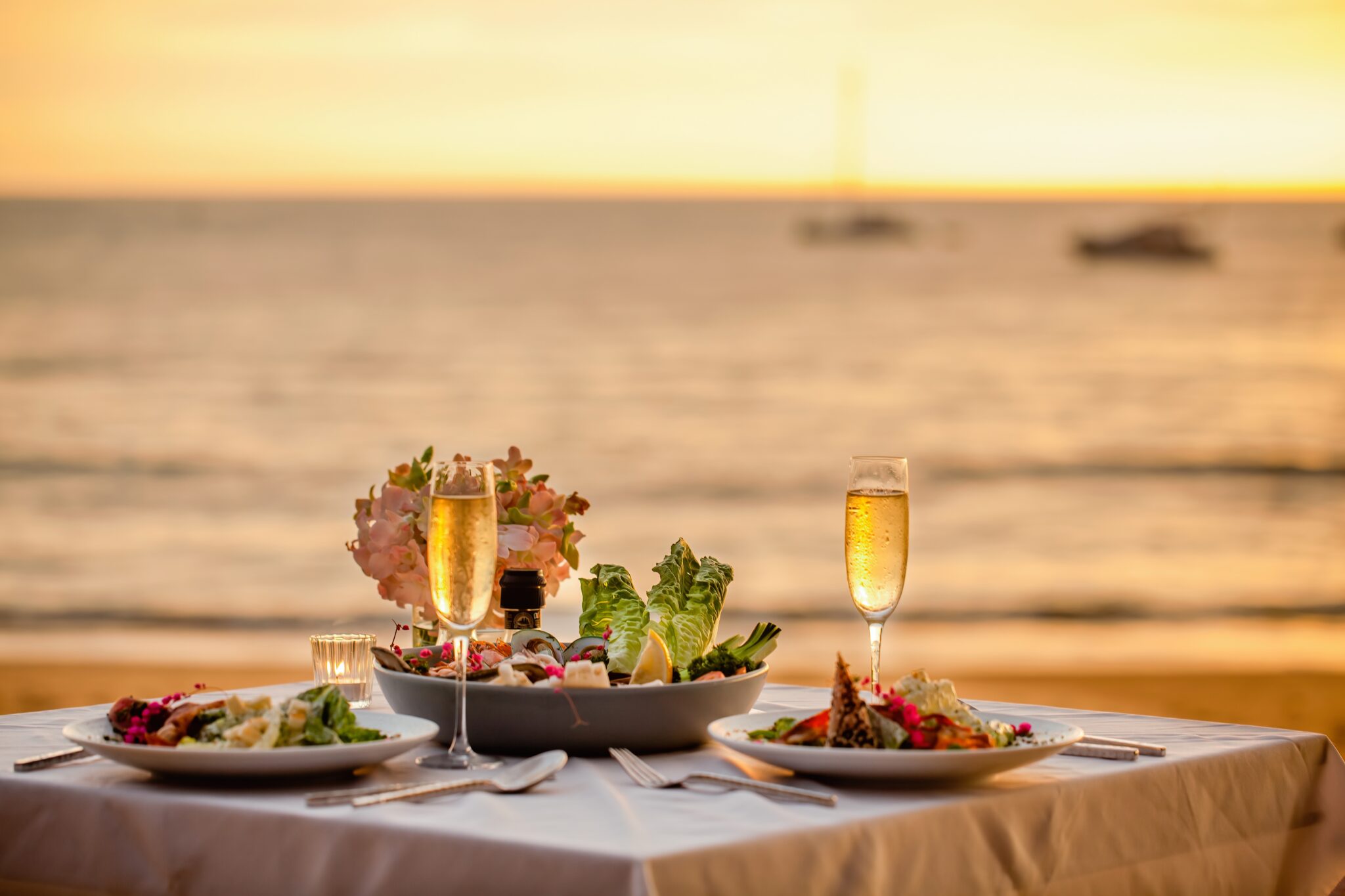 Romantic,Sunset,Dinner,On,Beach.,Table,Honeymoon,Set,For,Two