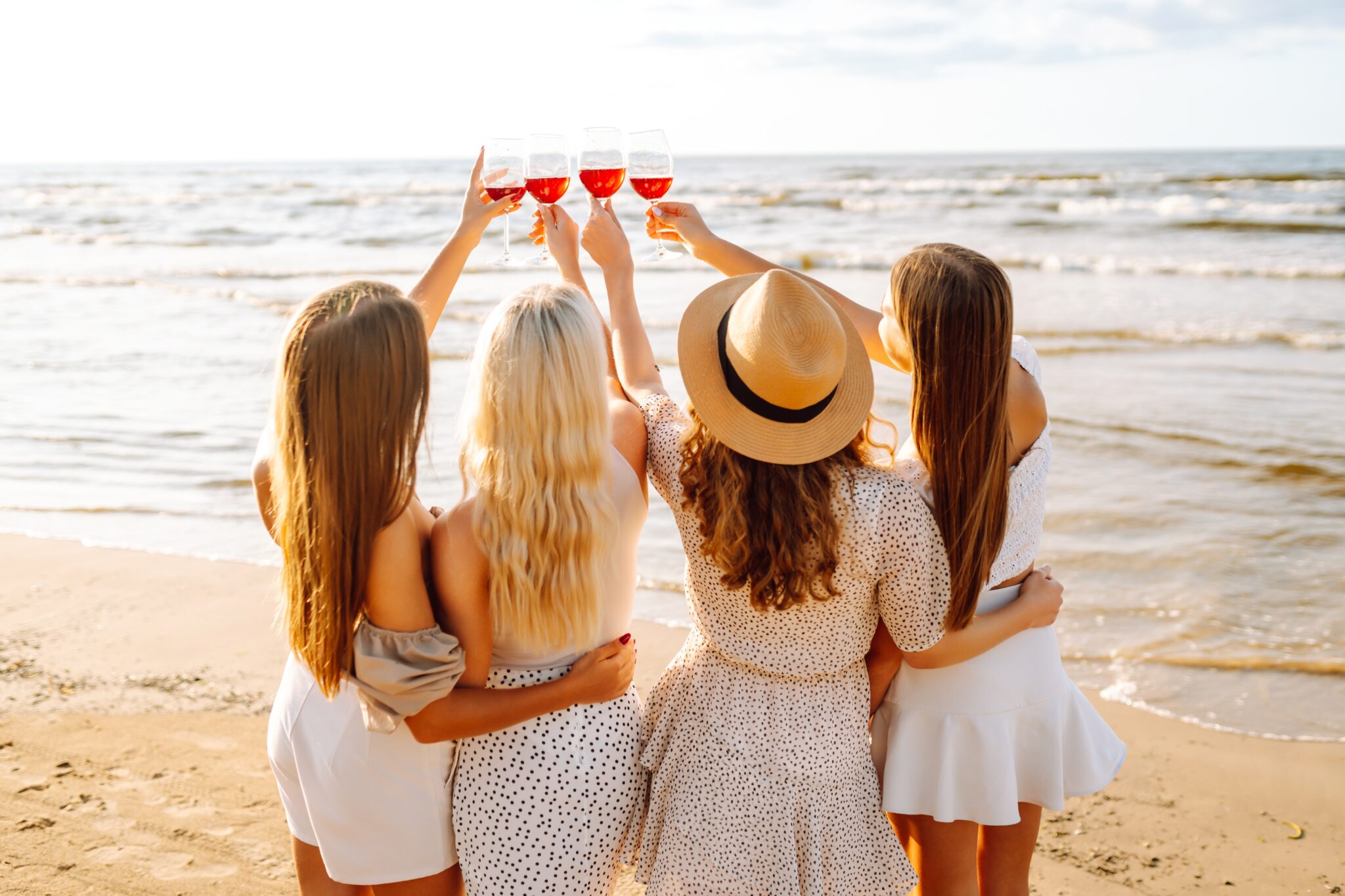 A,Group,Of,Girlfriends,Clinking,Glasses,Of,Wine,And,Spend