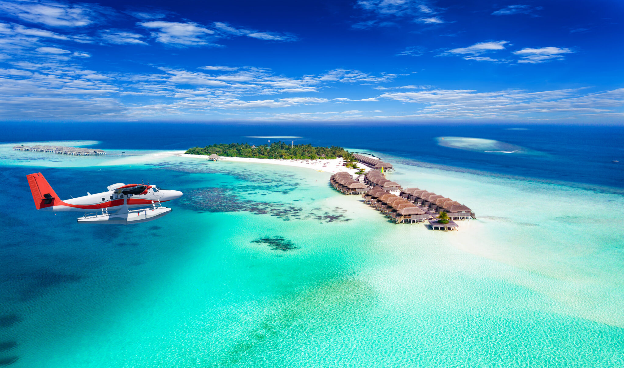Aerial,View,Of,A,Seaplane,Approaching,Island,In,The,Maldives